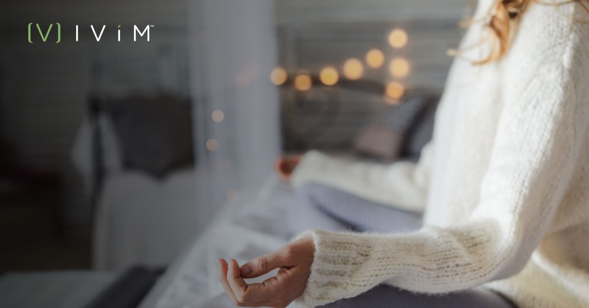 Person practicing meditation to build healthy habits and wellness during the holidays