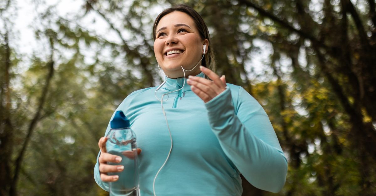Woman jogging outdoors to maintain a healthy lifestyle and support weight loss goals