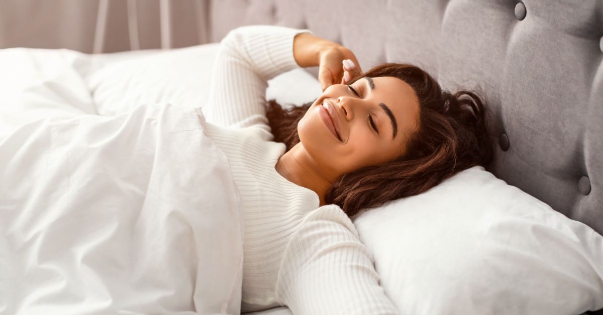 Woman sleeping peacefully in a calm and restful environment, emphasizing restorative sleep and circadian rhythm.